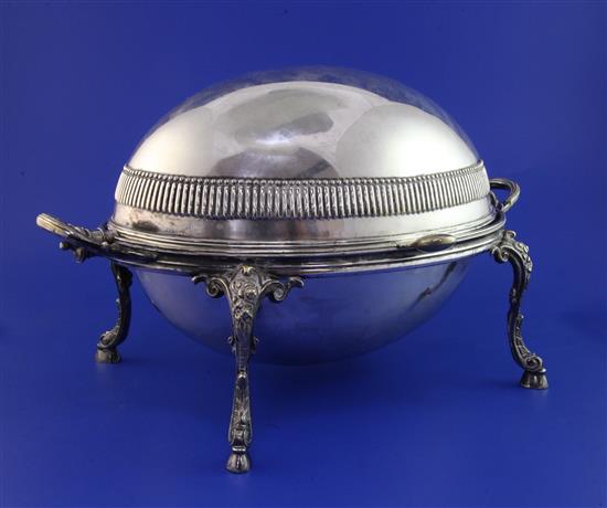 A Victorian silver plated revolving two handled breakfast tureen, 14in over handles.